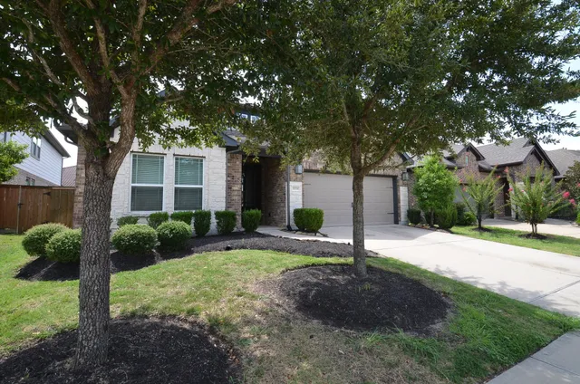 a house view with a garden space