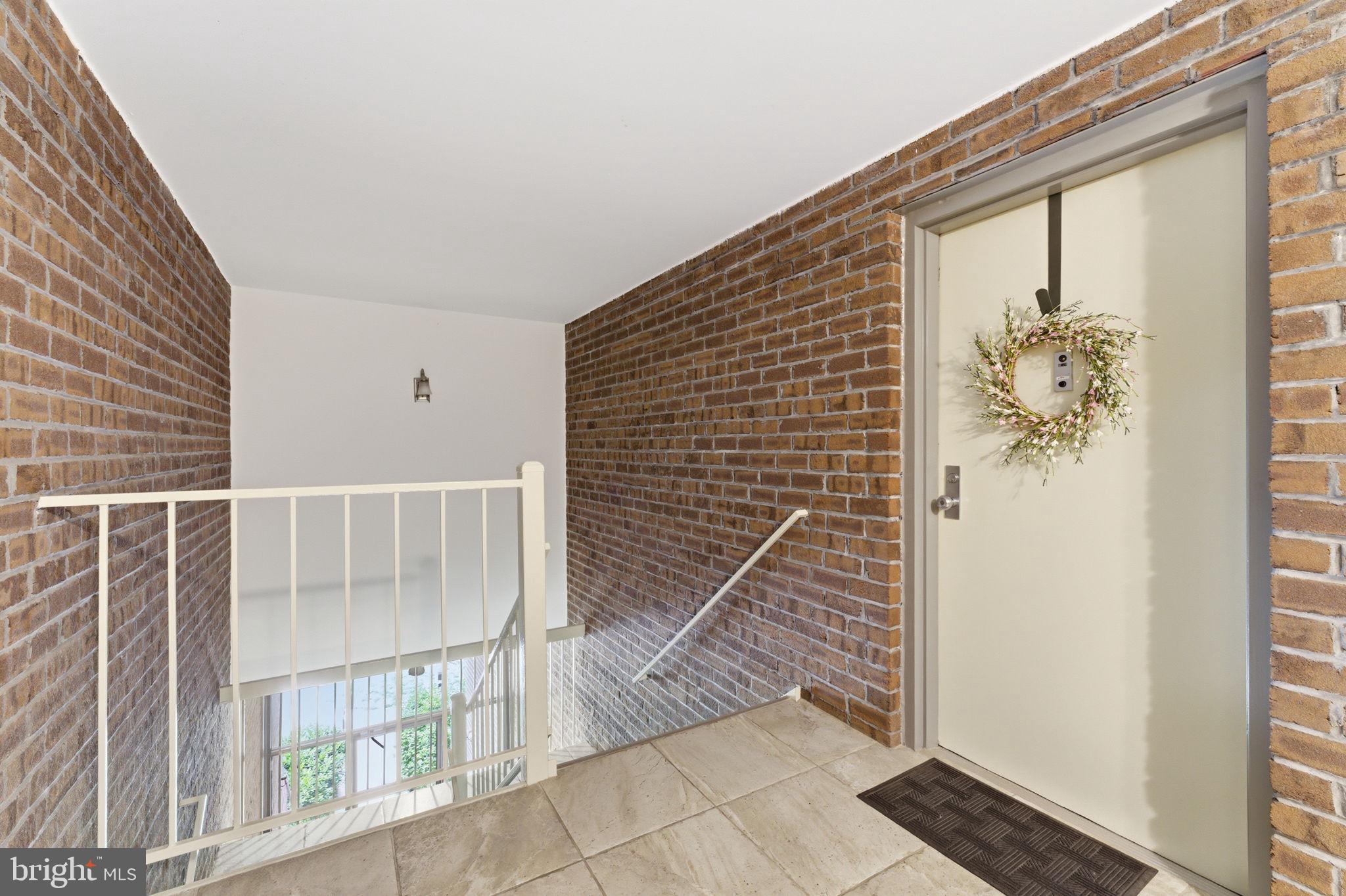 11260 Chestnut Grove Square, Unit 337 Reston, VA 20190 - Photo 55 of 82 Charming entryway with rustic flair.