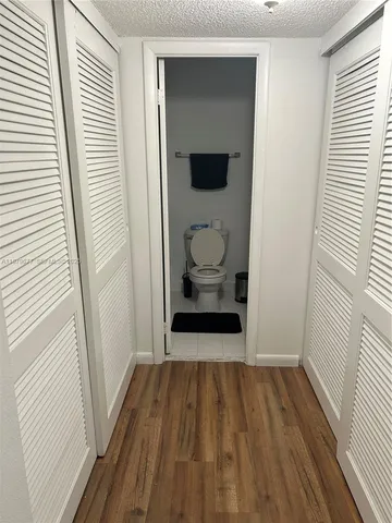 a hallway with wooden floor