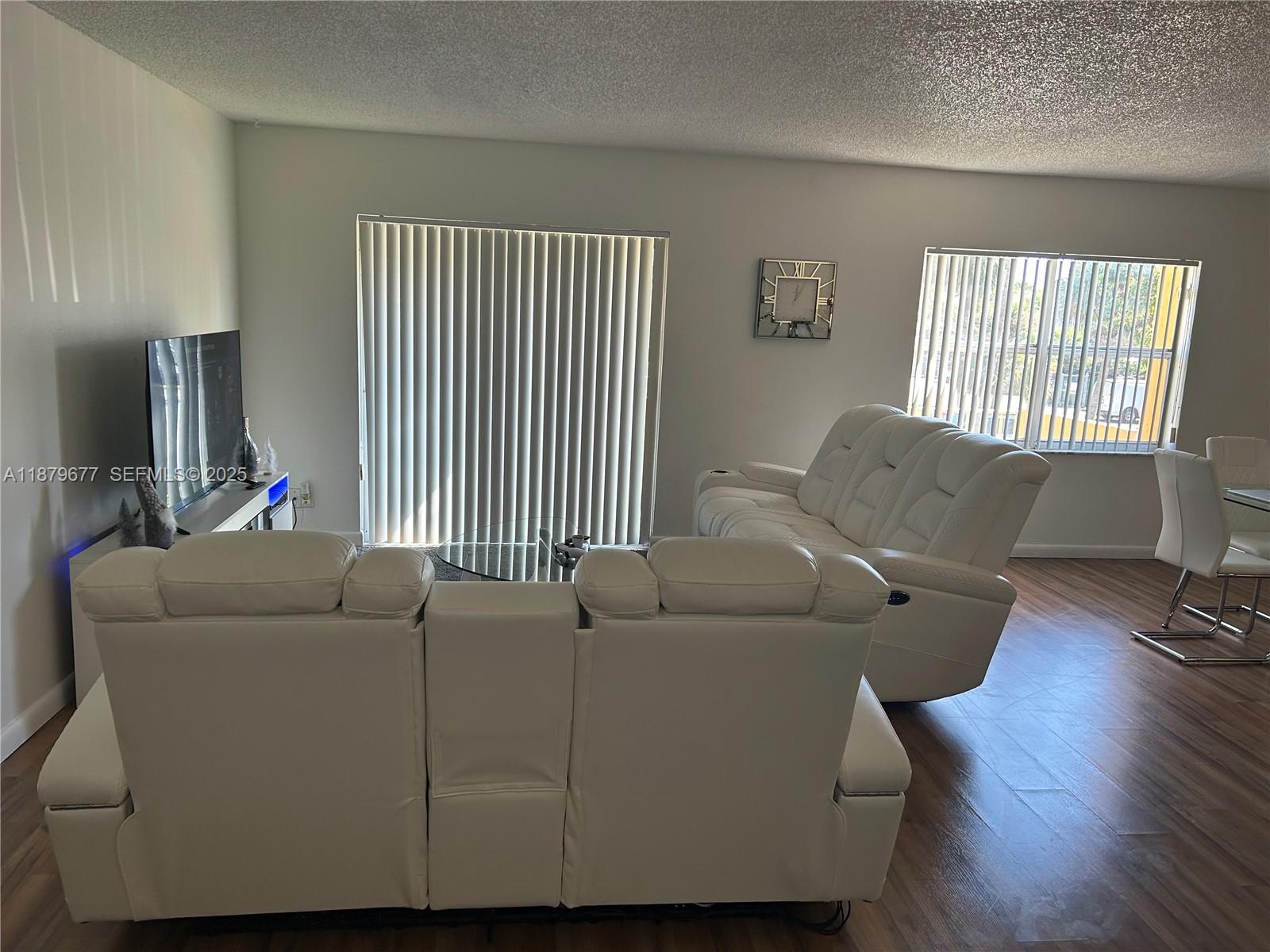 17901 Northwest 68th Avenue, Unit R209 Hialeah, FL 33015 - Photo 3 of 40 a living room with furniture and a window