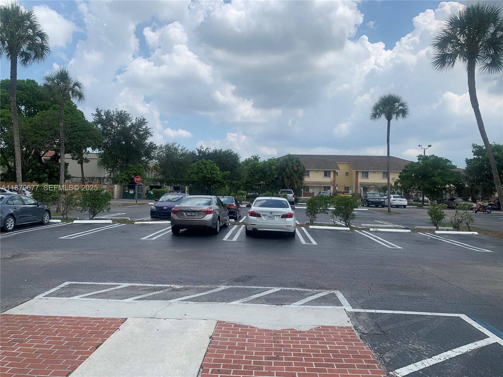 17901 Northwest 68th Avenue, Unit R209 Hialeah, FL 33015 - Photo 39 of 40 a view of street with parked cars