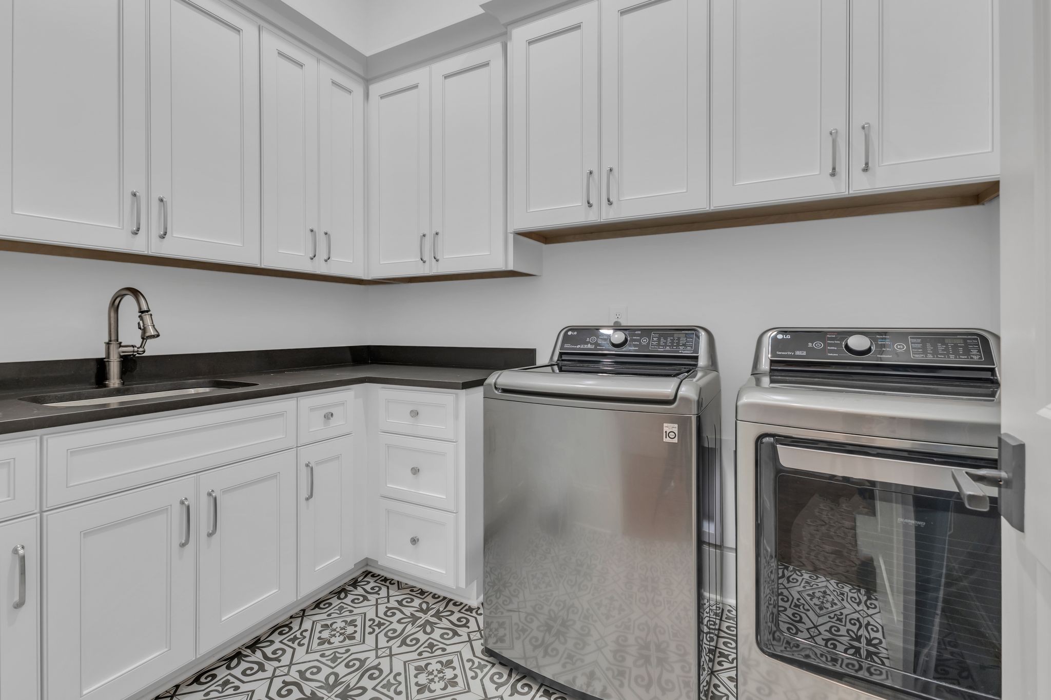 155 Splendor Ridge Drive Franklin, TN 37064 - Photo 21 of 52 a kitchen with white cabinets and a stove