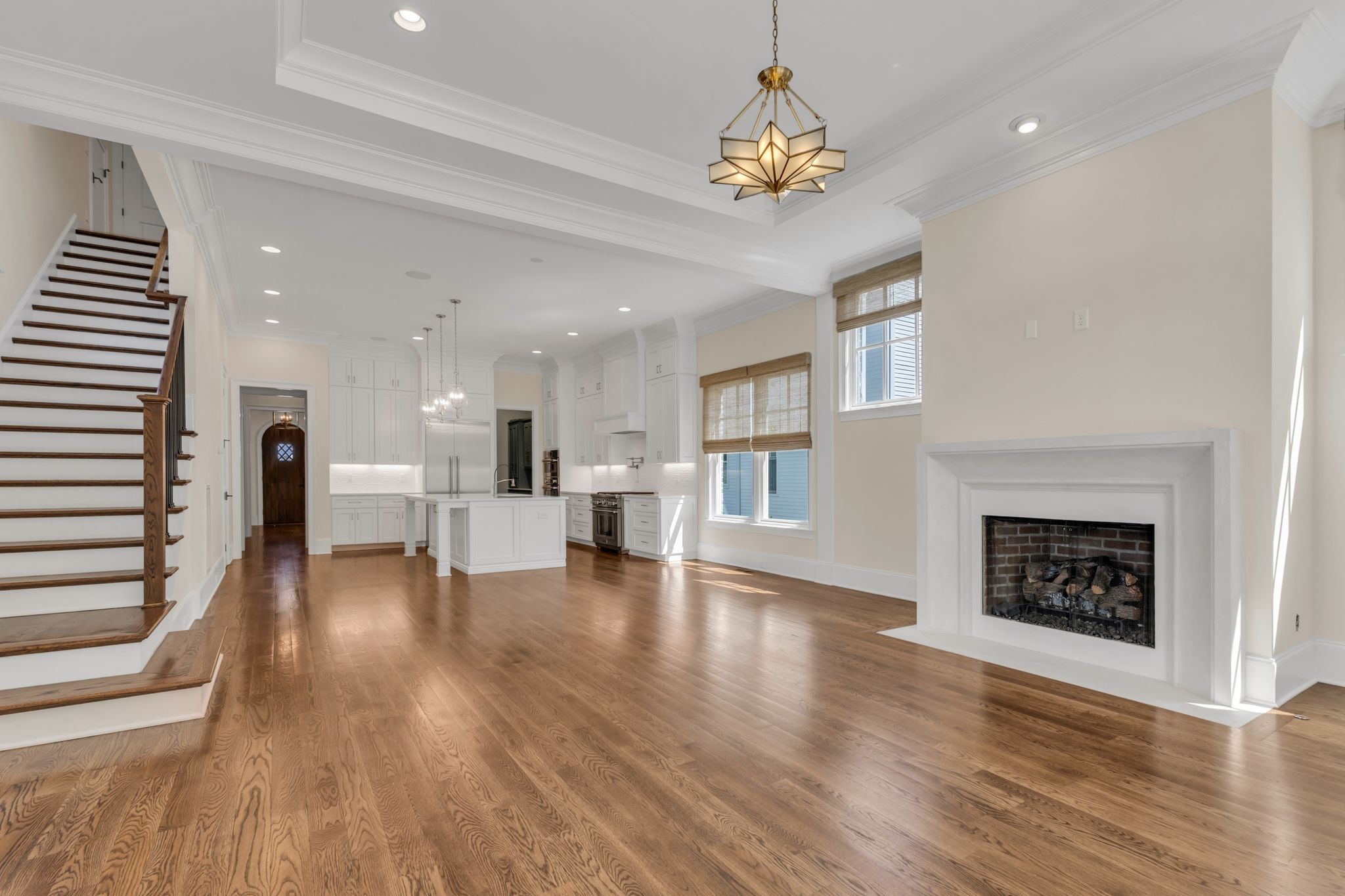155 Splendor Ridge Drive Franklin, TN 37064 - Photo 5 of 52 a view of a livingroom with wooden floor and a kitchen