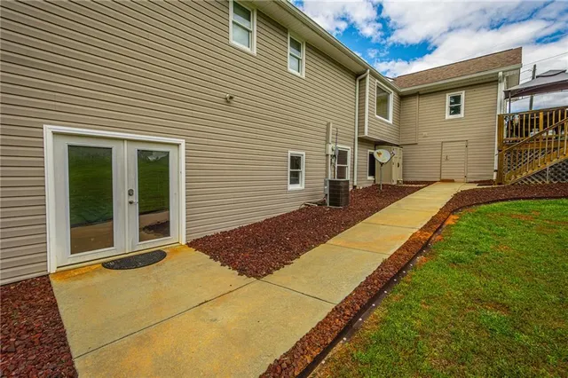 a kitchen with a sink cabinets and wooden floor