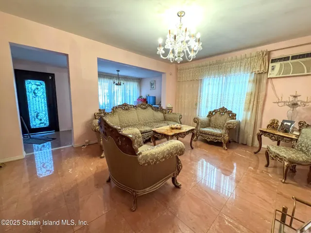 a bedroom with bed and a window