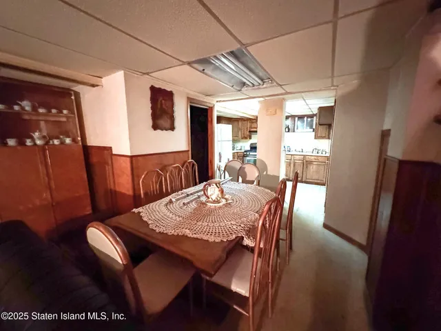 a kitchen with sink refrigerator and cabinets