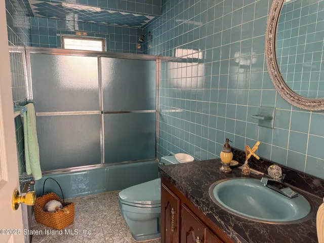 a view of a livingroom with furniture and a window