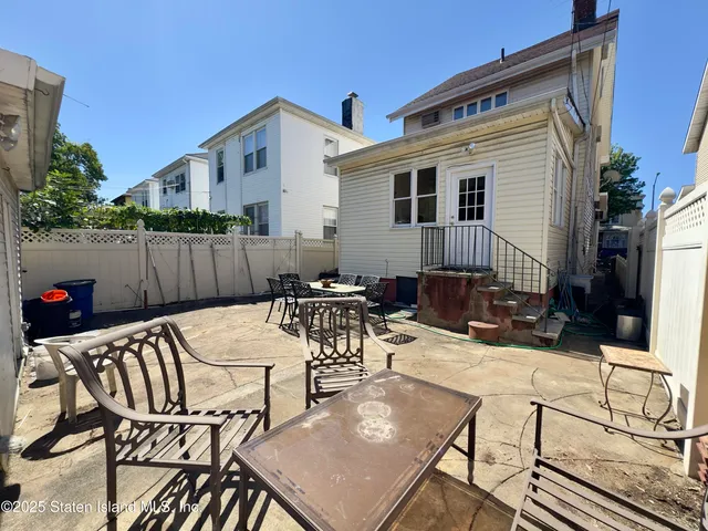 a bedroom with bed and window