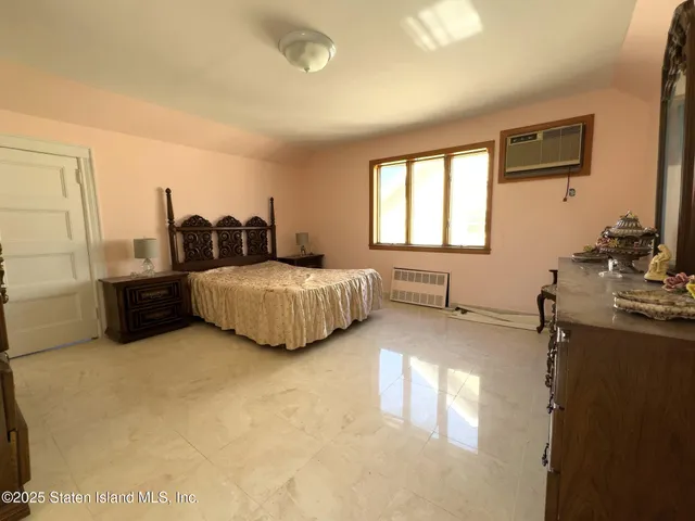 a view of a patio with table and chairs with wooden floor and plants