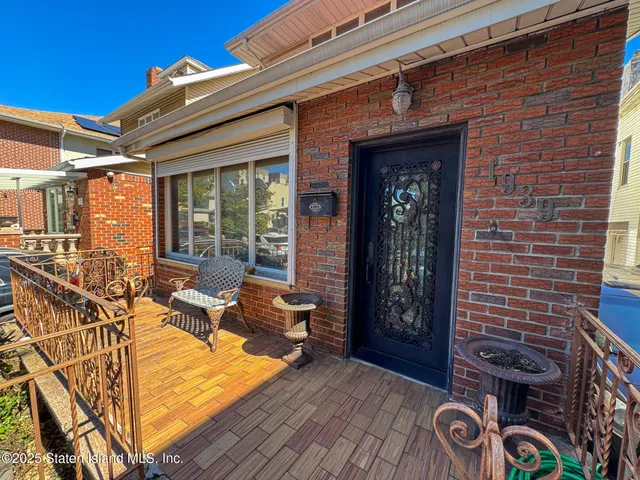 a front view of house with yard outdoor seating and barbeque oven