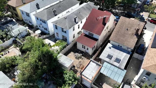 a kitchen with stainless steel appliances granite countertop a stove a sink dishwasher a refrigerator and cabinets with wooden floor