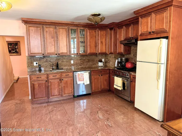 a view of a a dining room with furniture window and wooden floor