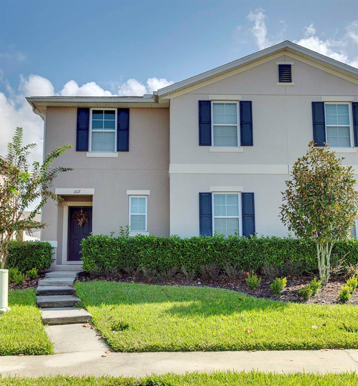 1617 Reflection Cove St. Cloud, FL 34771 - Photo 1 of 1 a front view of a house with a yard