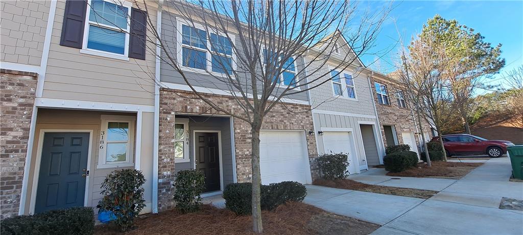 3184 Delancy Street Decatur, GA 30035 - Photo 1 of 1 a front view of a house with a garden
