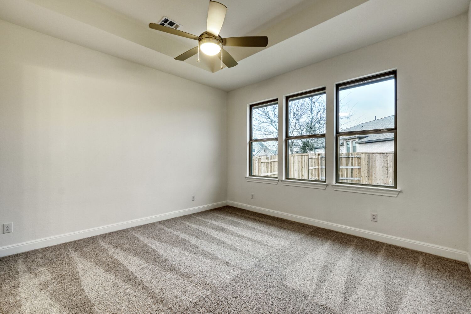 253 Prickly Poppy Loop Kyle, TX 78640 - Photo 10 of 11 a view of an empty room with a window