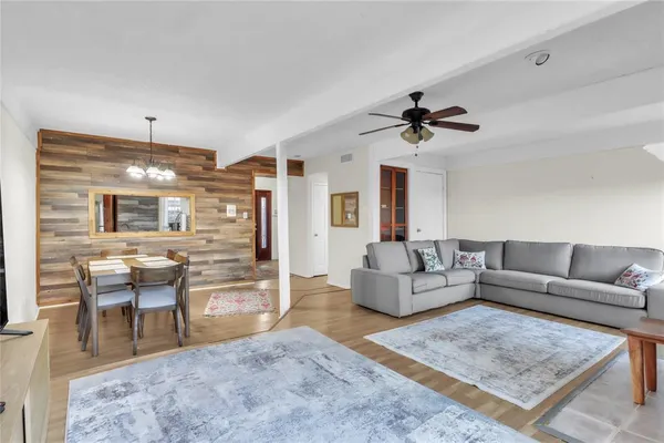 a living room with furniture a fireplace and a table