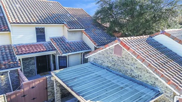 a view of a roof deck with wooden floor and fence