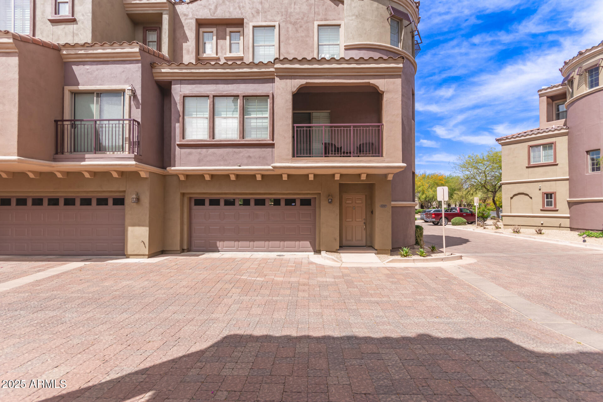 3935 East Rough Rider Road, Unit 1197 Phoenix, AZ 85050 - Photo 2 of 31 a front view of a building