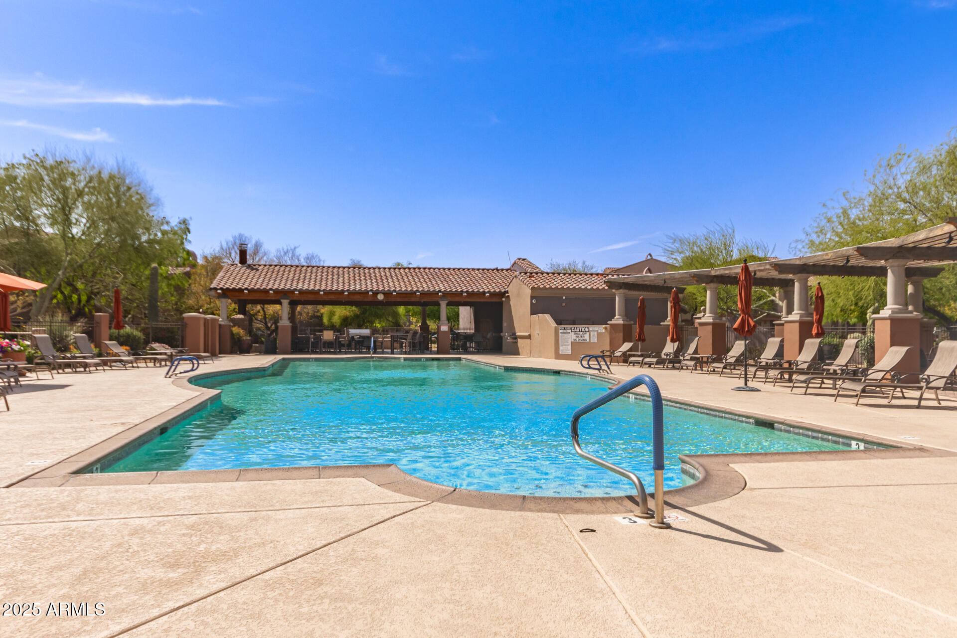 3935 East Rough Rider Road, Unit 1197 Phoenix, AZ 85050 - Photo 27 of 31 a view of a house with backyard porch and sitting area