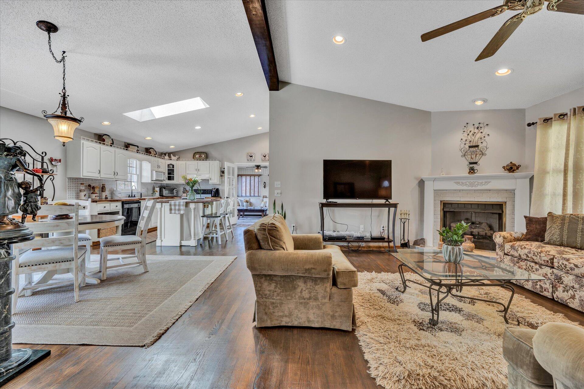 1077 Hopkins Road Rocky Mount, VA 24151 - Photo 11 of 69 a living room with furniture a flat screen tv and a fireplace