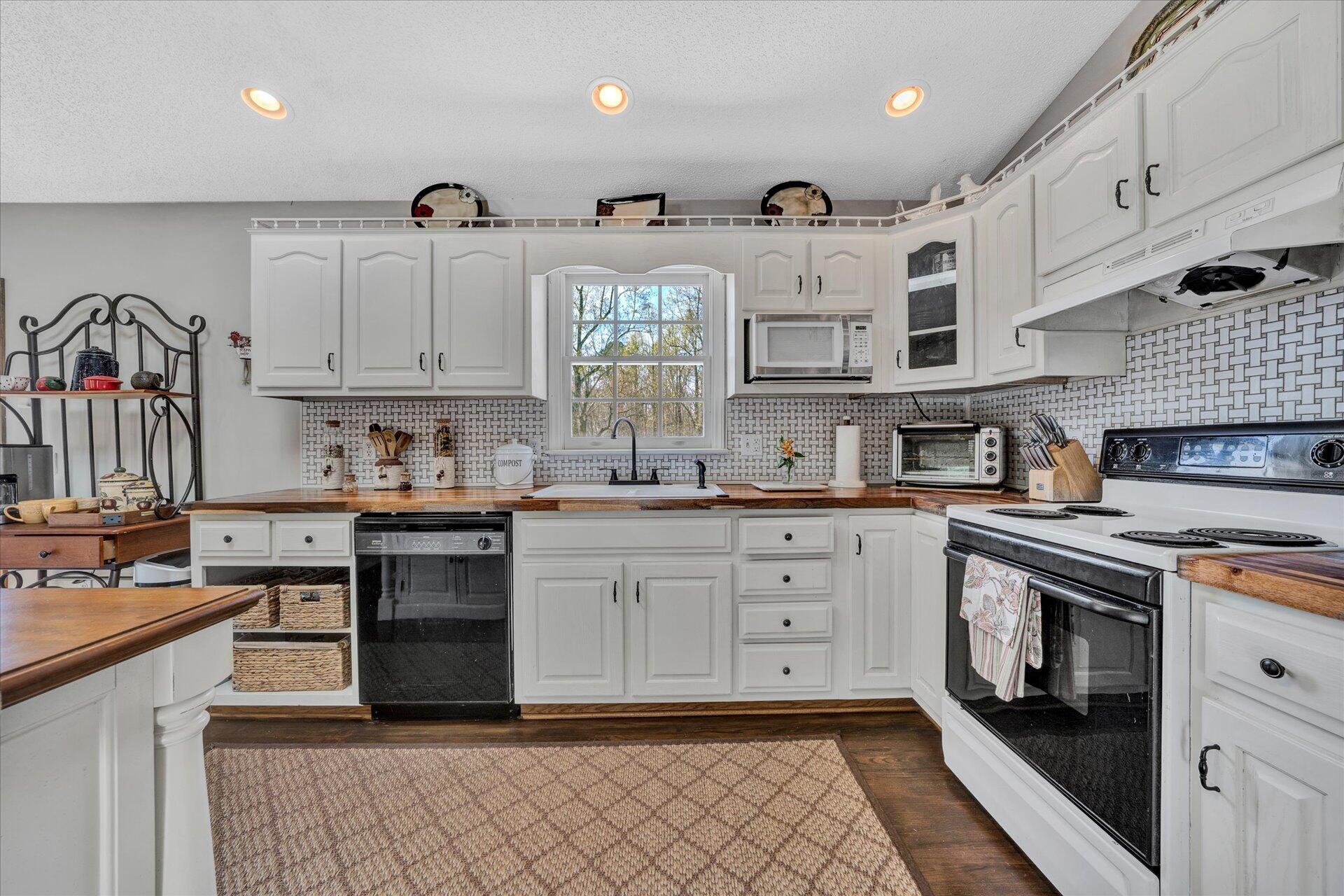 1077 Hopkins Road Rocky Mount, VA 24151 - Photo 15 of 69 a kitchen with stainless steel appliances granite countertop a sink and cabinets