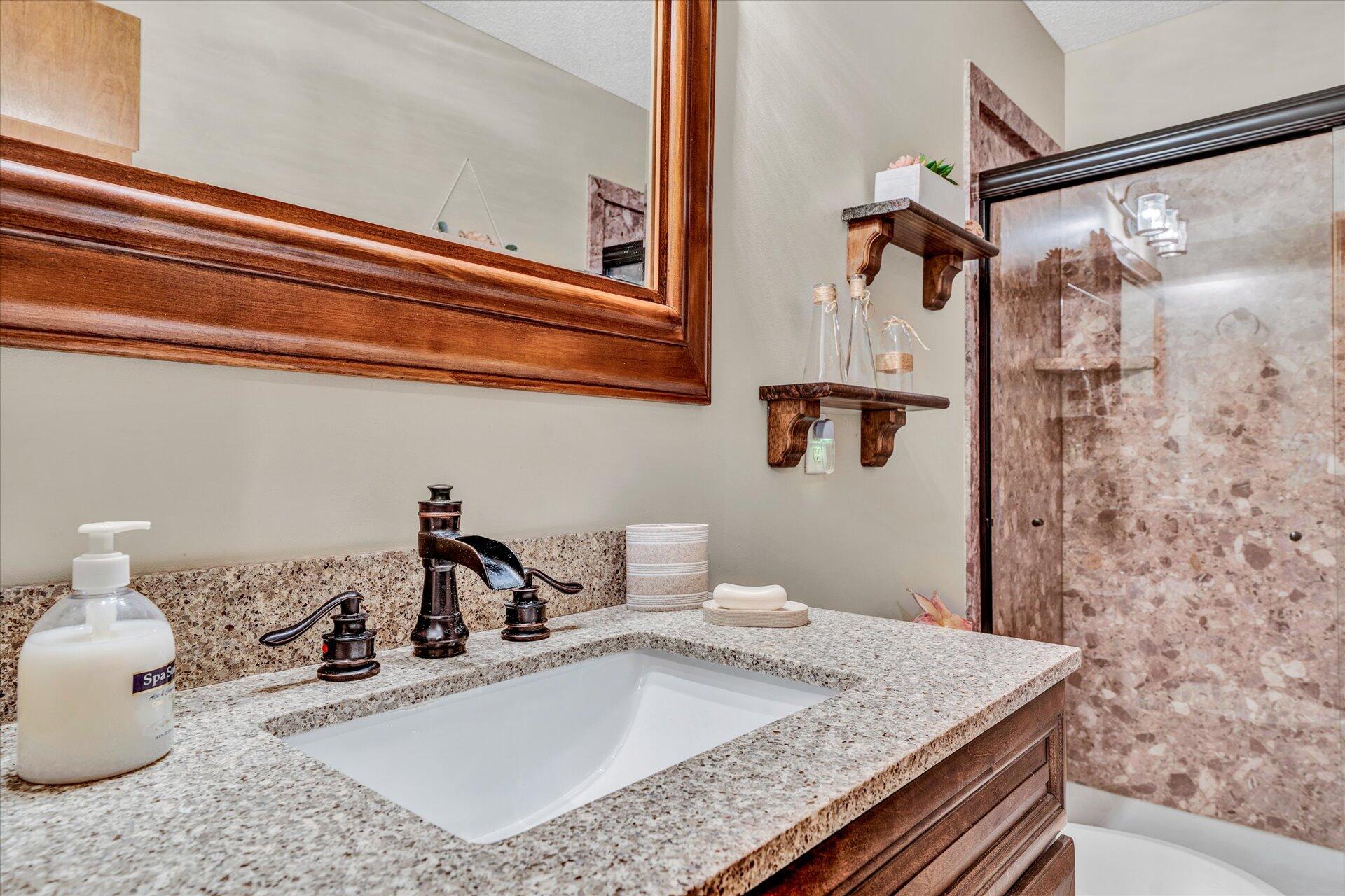 1077 Hopkins Road Rocky Mount, VA 24151 - Photo 31 of 69 a bathroom with a granite countertop sink and a mirror