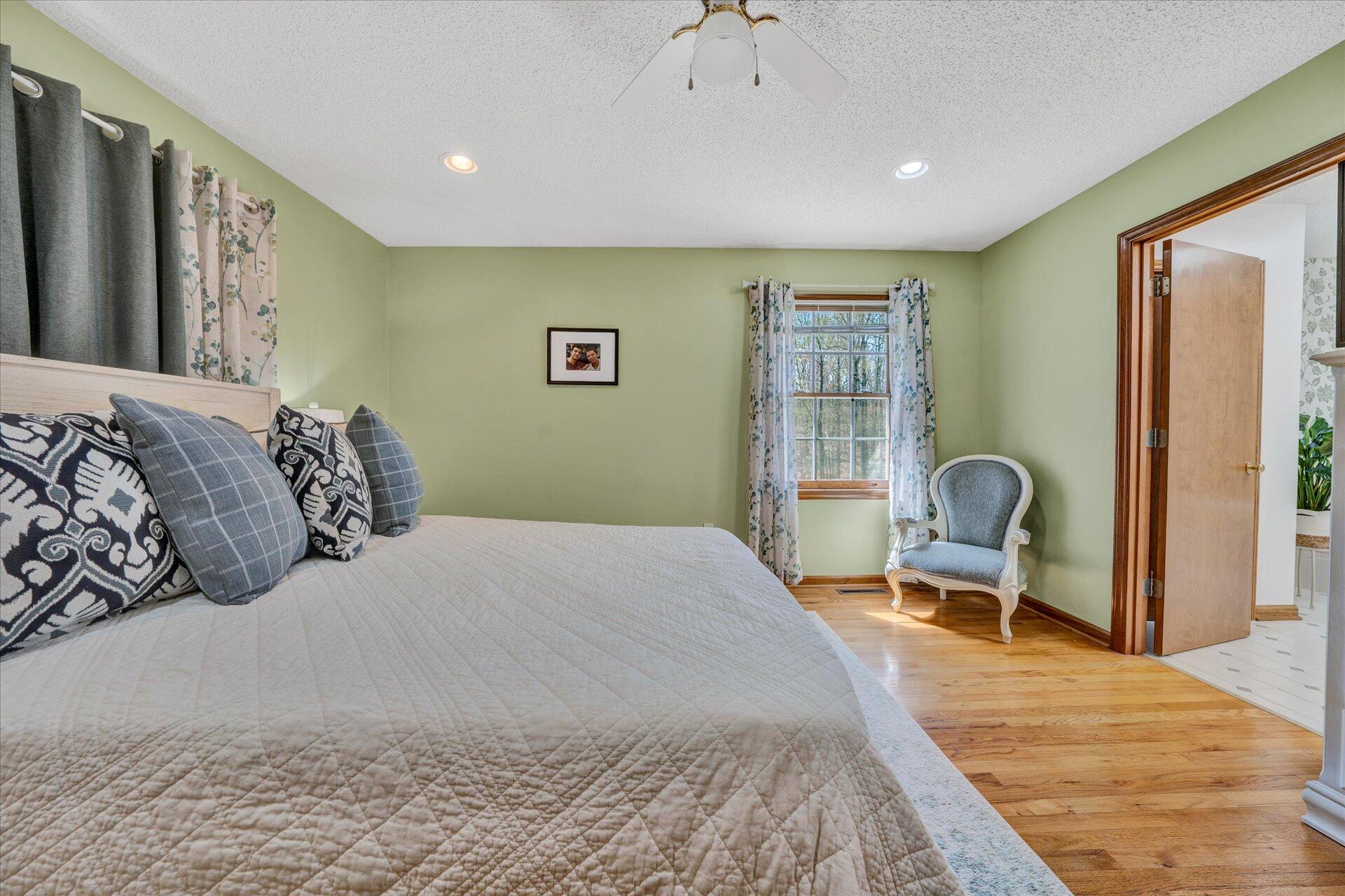 1077 Hopkins Road Rocky Mount, VA 24151 - Photo 33 of 69 a bedroom with a bed and a dresser next to a window