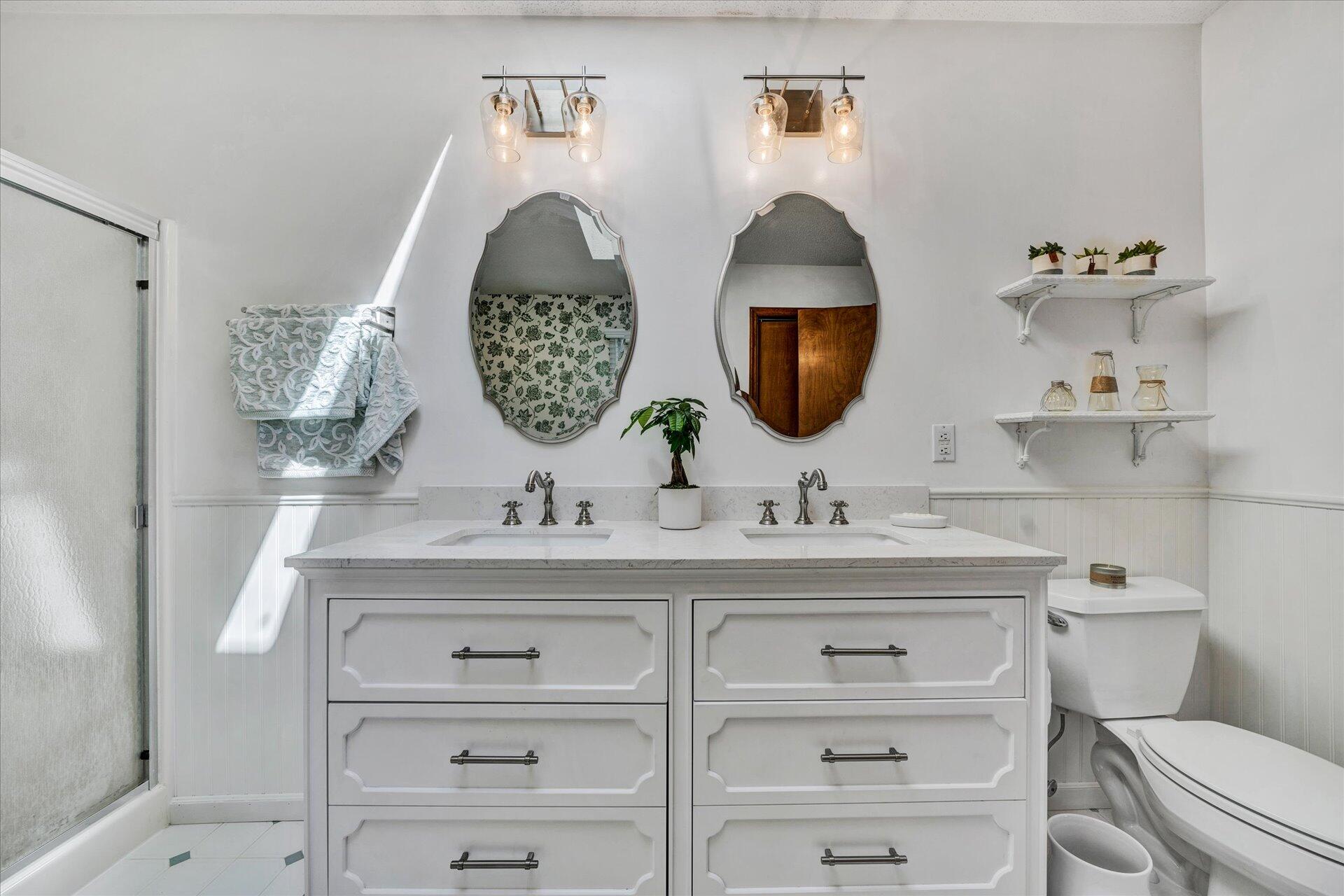 1077 Hopkins Road Rocky Mount, VA 24151 - Photo 36 of 69 a bathroom with a toilet a sink and mirror
