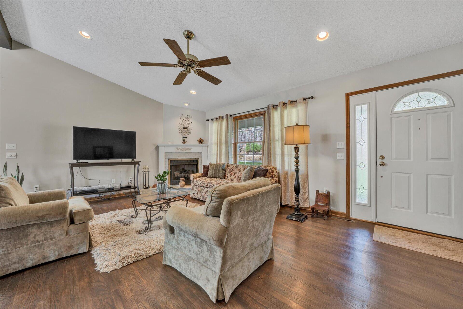 1077 Hopkins Road Rocky Mount, VA 24151 - Photo 10 of 69 a living room with fireplace furniture and a flat screen tv