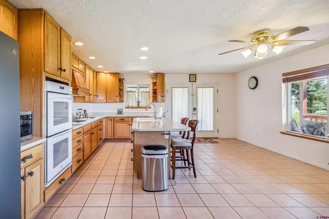 a bathroom with a toilet a sink and a mirror