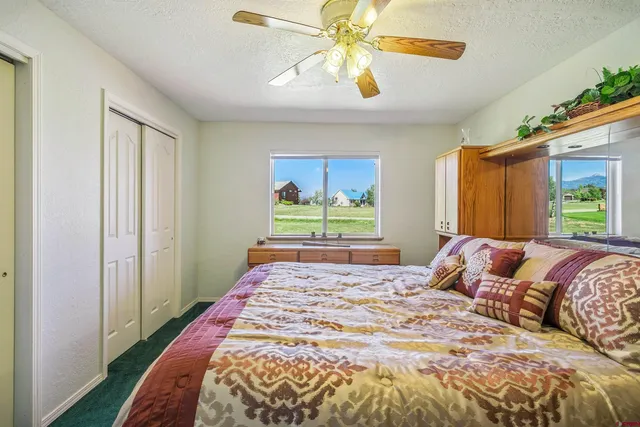 a view of a kitchen with sink and cabinets