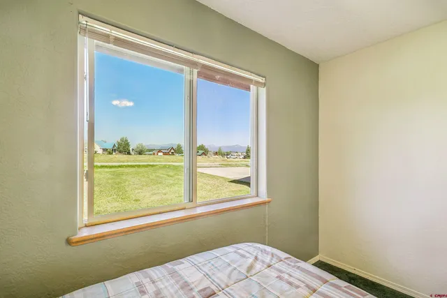 a view of a house with a yard and a swimming pool