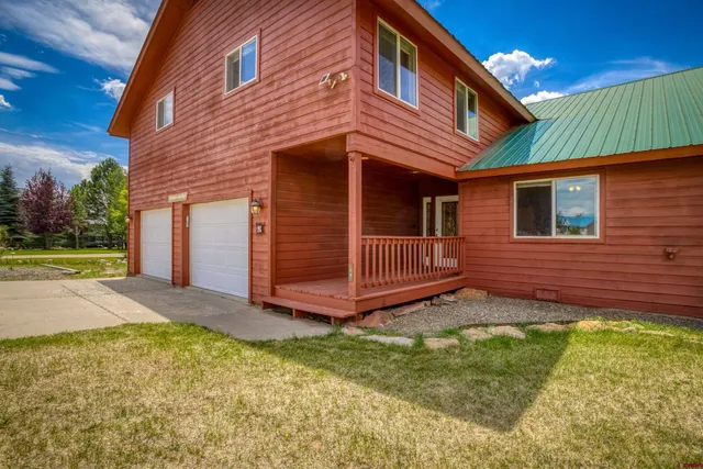 a view of a room with wooden floor and windows