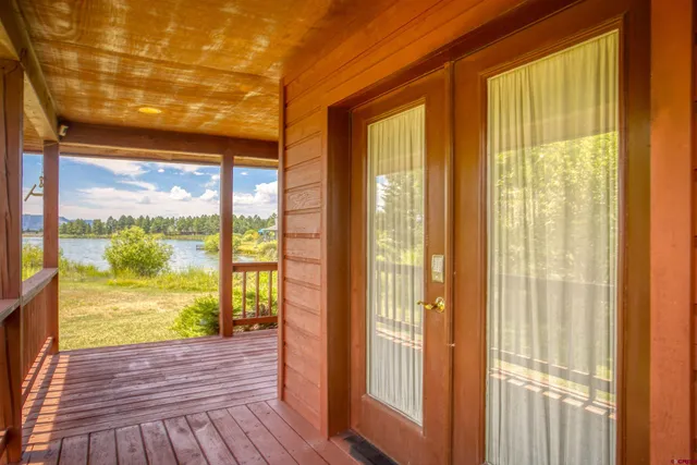 a view of a lake with a house in the background
