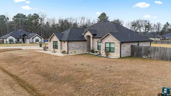 a view of a dining room with furniture and window