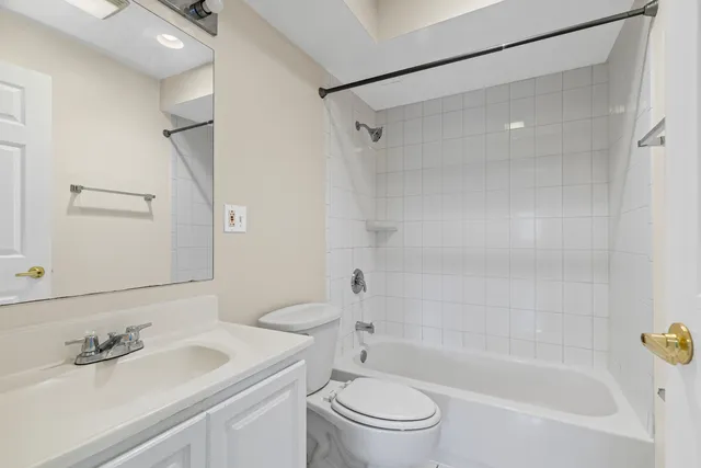 a front view of a house with a garden and porch