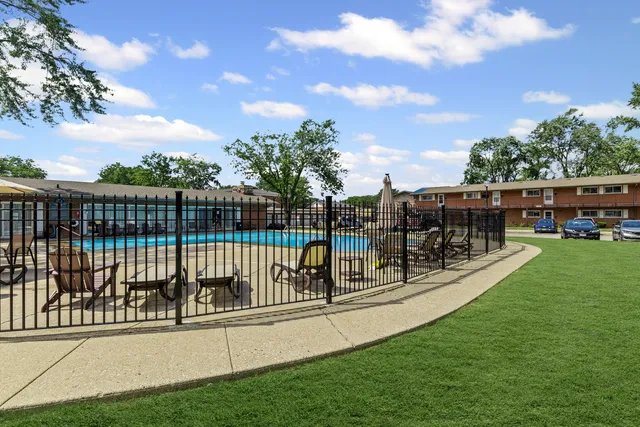 a front view of a brick house with a yard