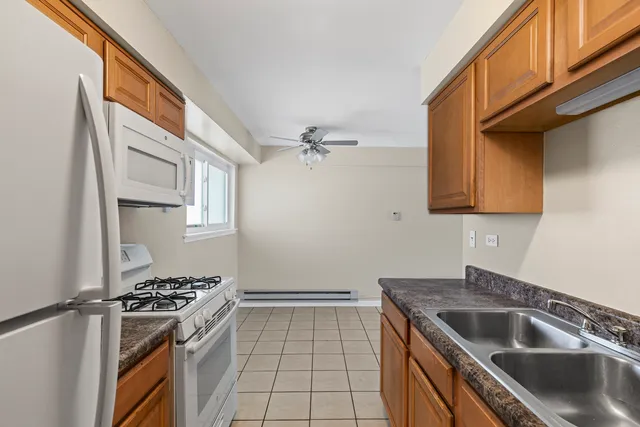 a kitchen with stainless steel appliances granite countertop a stove and a sink