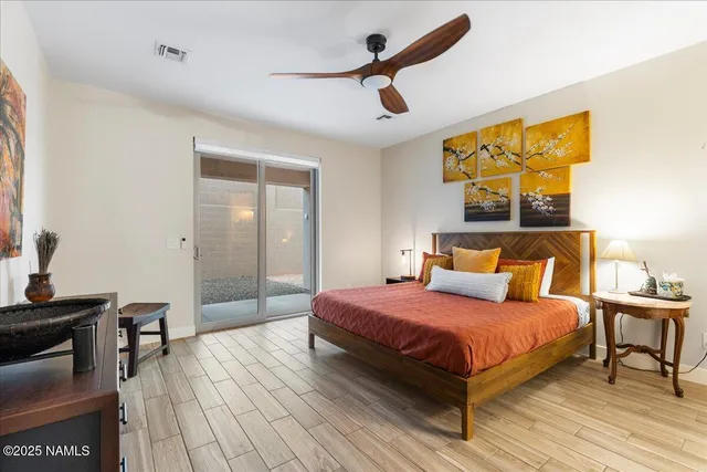 a bedroom with a bed and a table in it