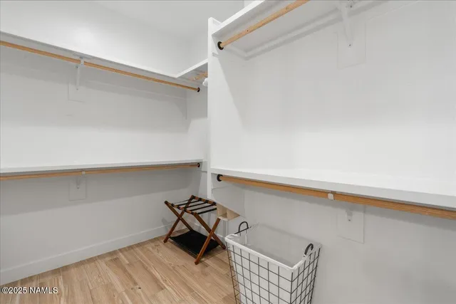 a bedroom with a bed and a table