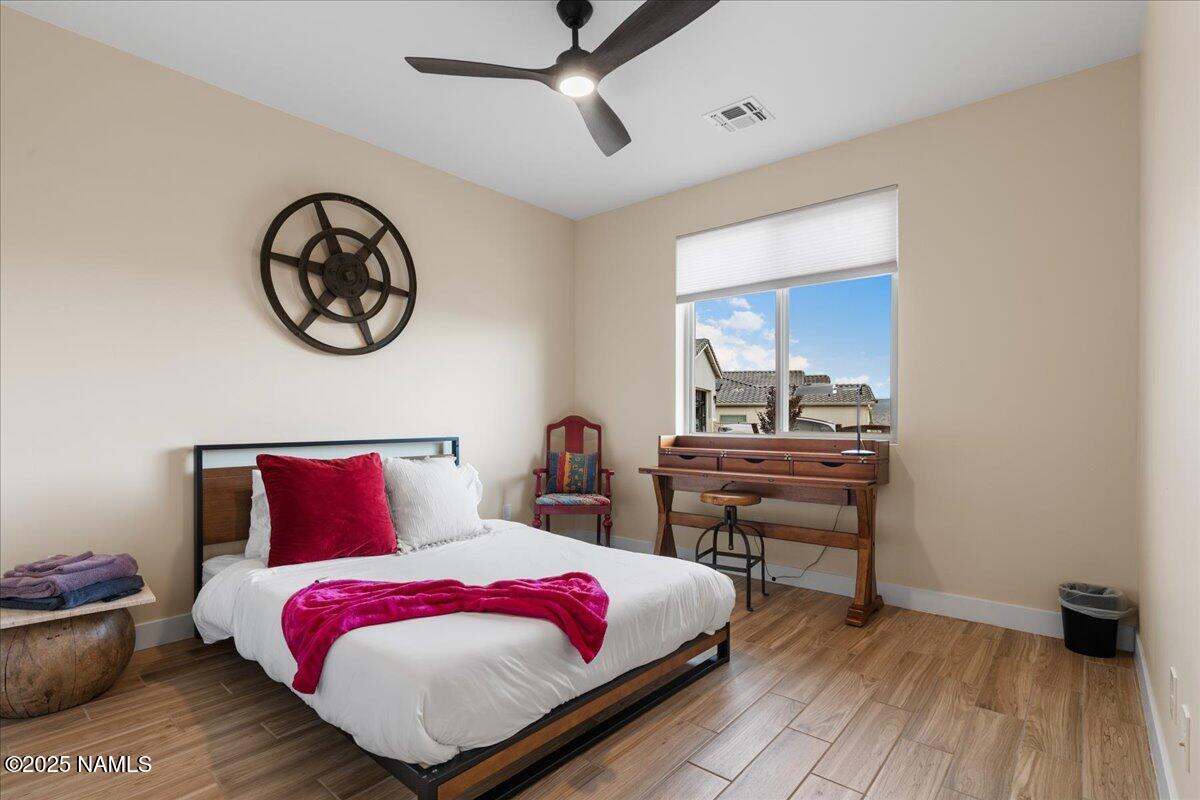 524 Powder Box Road Clarkdale, AZ 86324 - Photo 18 of 32 a bedroom with a bed and a table
