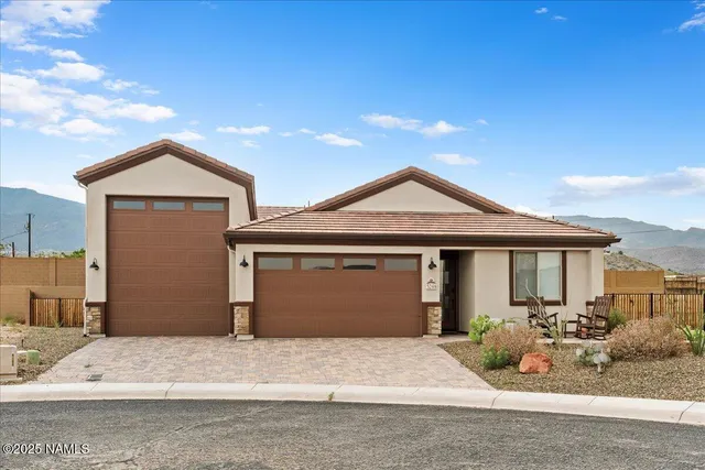 a front view of a house with yard