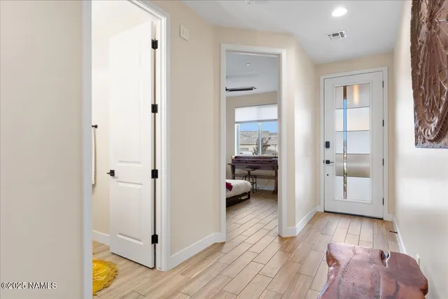 a very nice looking room with a big room and wooden floor