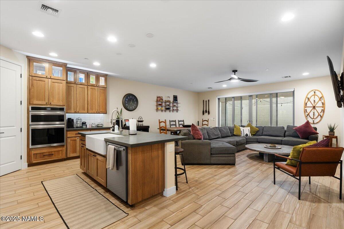 524 Powder Box Road Clarkdale, AZ 86324 - Photo 6 of 32 a living room with stainless steel appliances granite countertop furniture a kitchen view and wooden floor