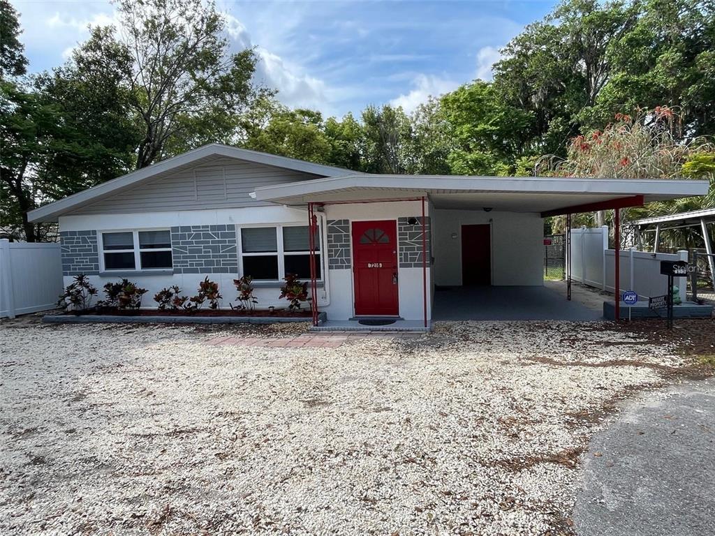 7216 James Street Port Richey, FL 34668 - Photo 1 of 28 a house with trees in the background
