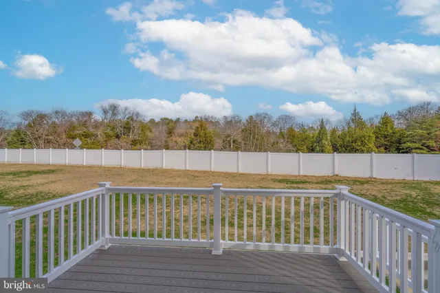 a view of deck with wooden floor and fence
