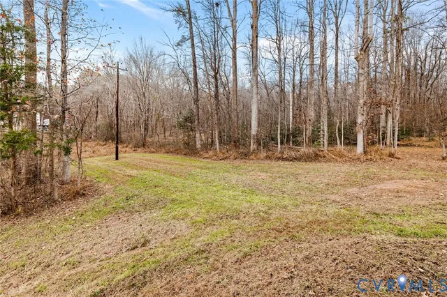 a backyard of apartments with large trees