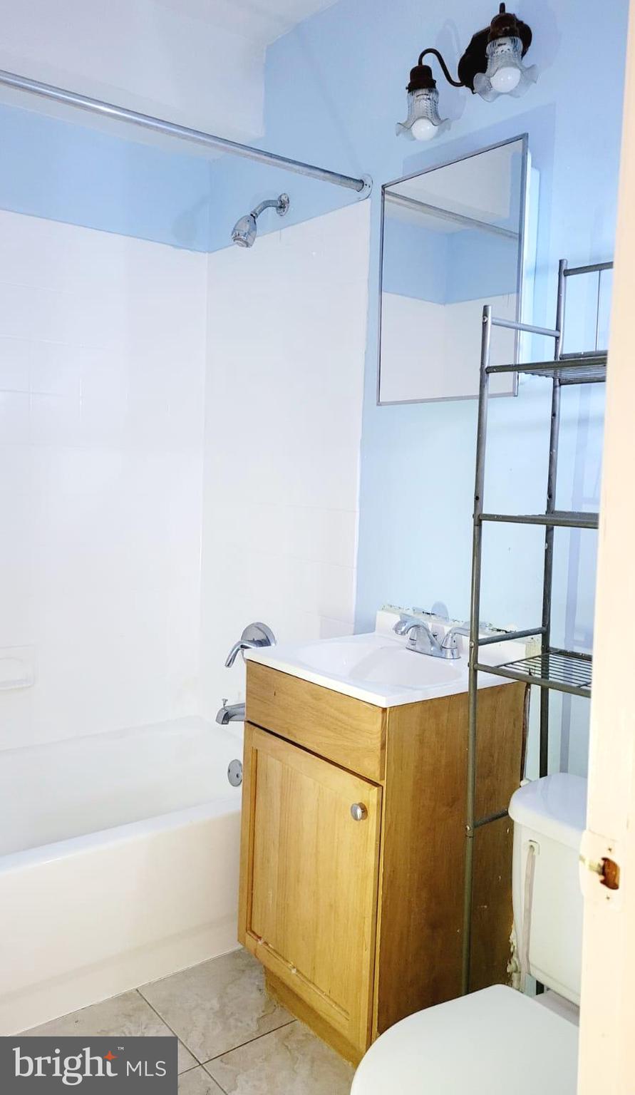 1712 Capitol Avenue Northeast Washington, DC 20002 - Photo 14 of 15 a bathroom with a sink a toilet and shower