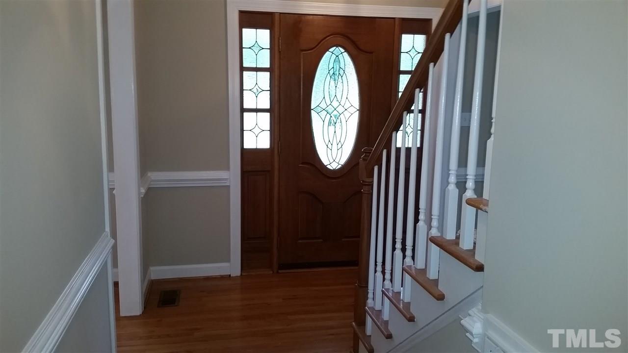 901 Lendermans Circle Raleigh, NC 27603 - Photo 3 of 25 a view of staircase with wooden floor