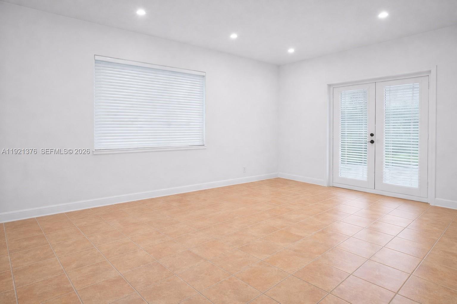 100 Southwest 30th Road Miami, FL 33129 - Photo 13 of 31 a view of an empty room with a window